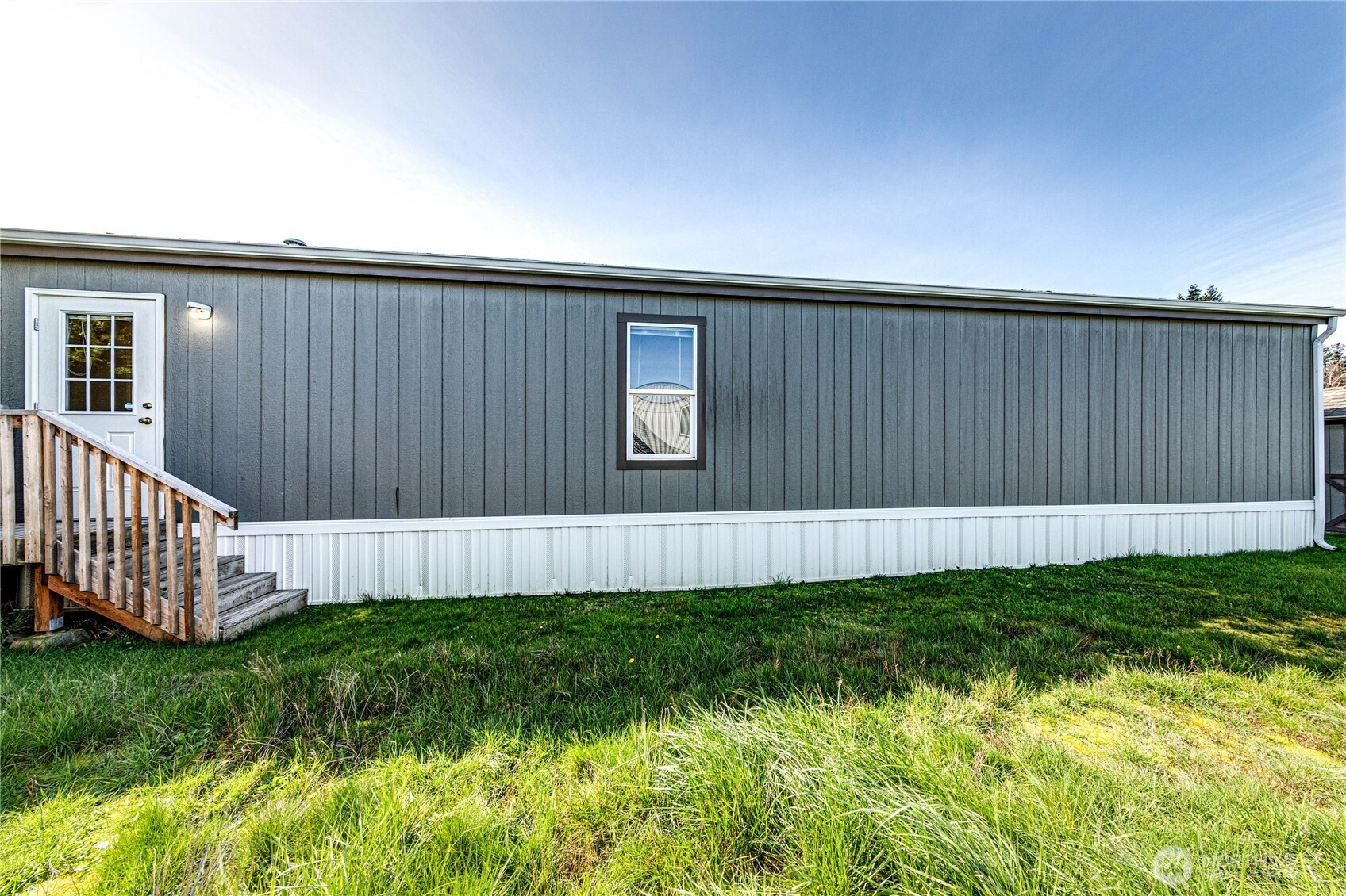 491 Mill Road, Unit 8 Sequim, WA 98382 - Photo 20 of 37 a view of a backyard with wooden fence