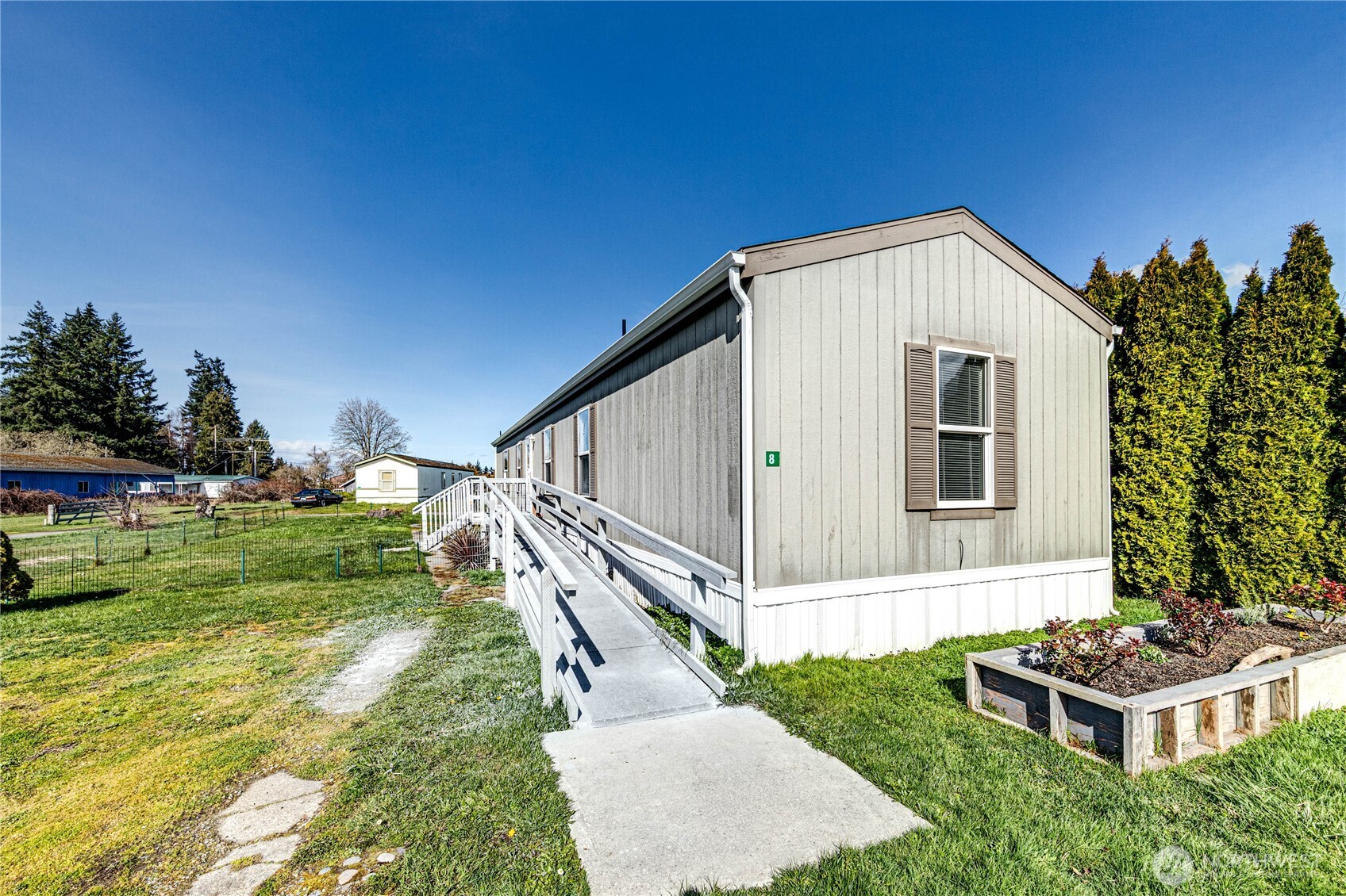 491 Mill Road, Unit 8 Sequim, WA 98382 - Photo 23 of 37 a house view with a garden space