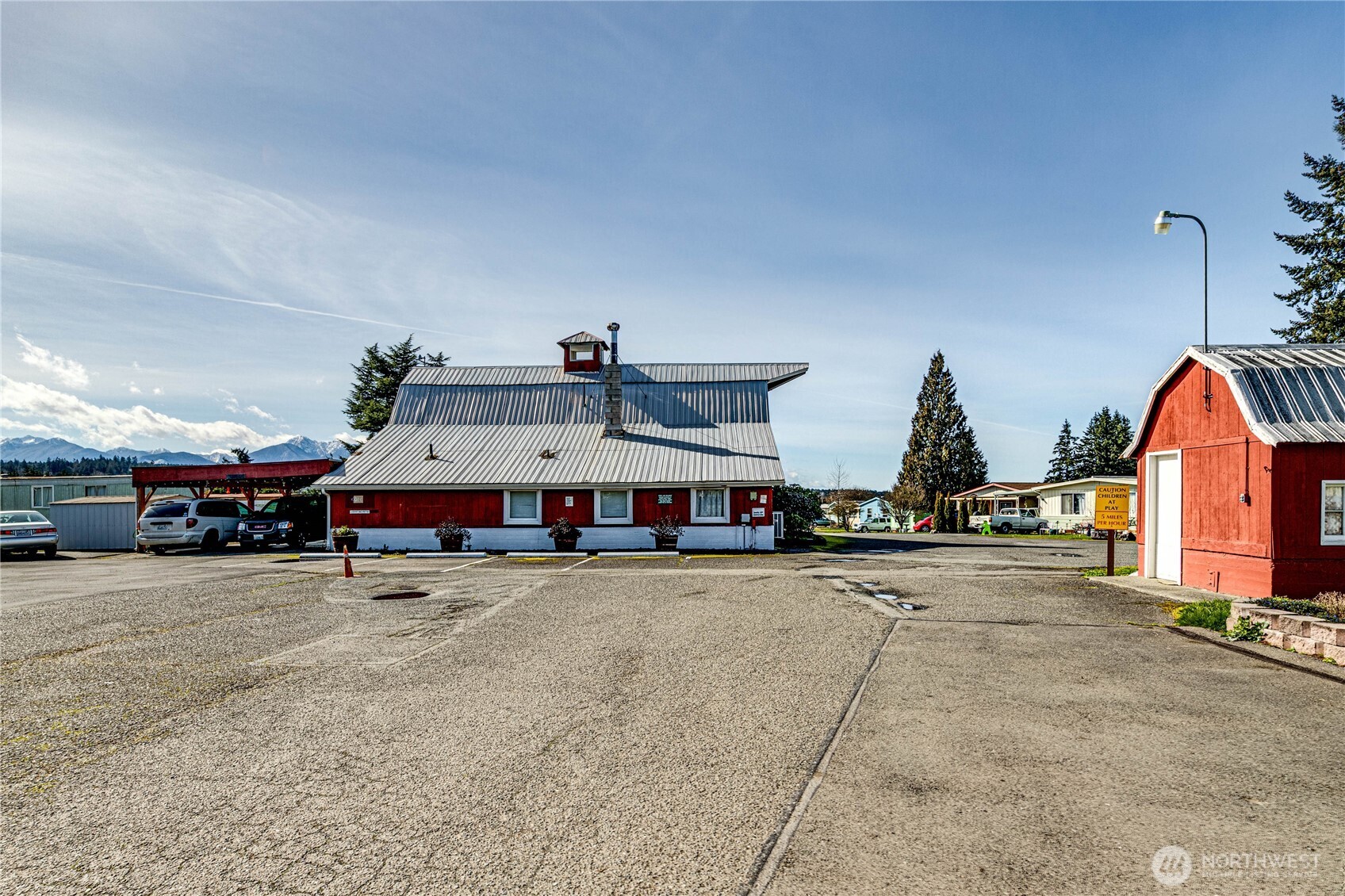 491 Mill Road, Unit 8 Sequim, WA 98382 - Photo 24 of 37 a view of a big room with lots of space and car parked