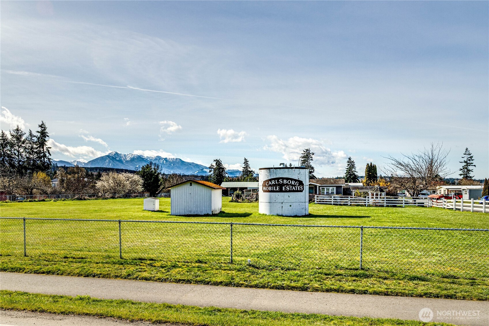 491 Mill Road, Unit 8 Sequim, WA 98382 - Photo 25 of 37 a view of a house with a yard