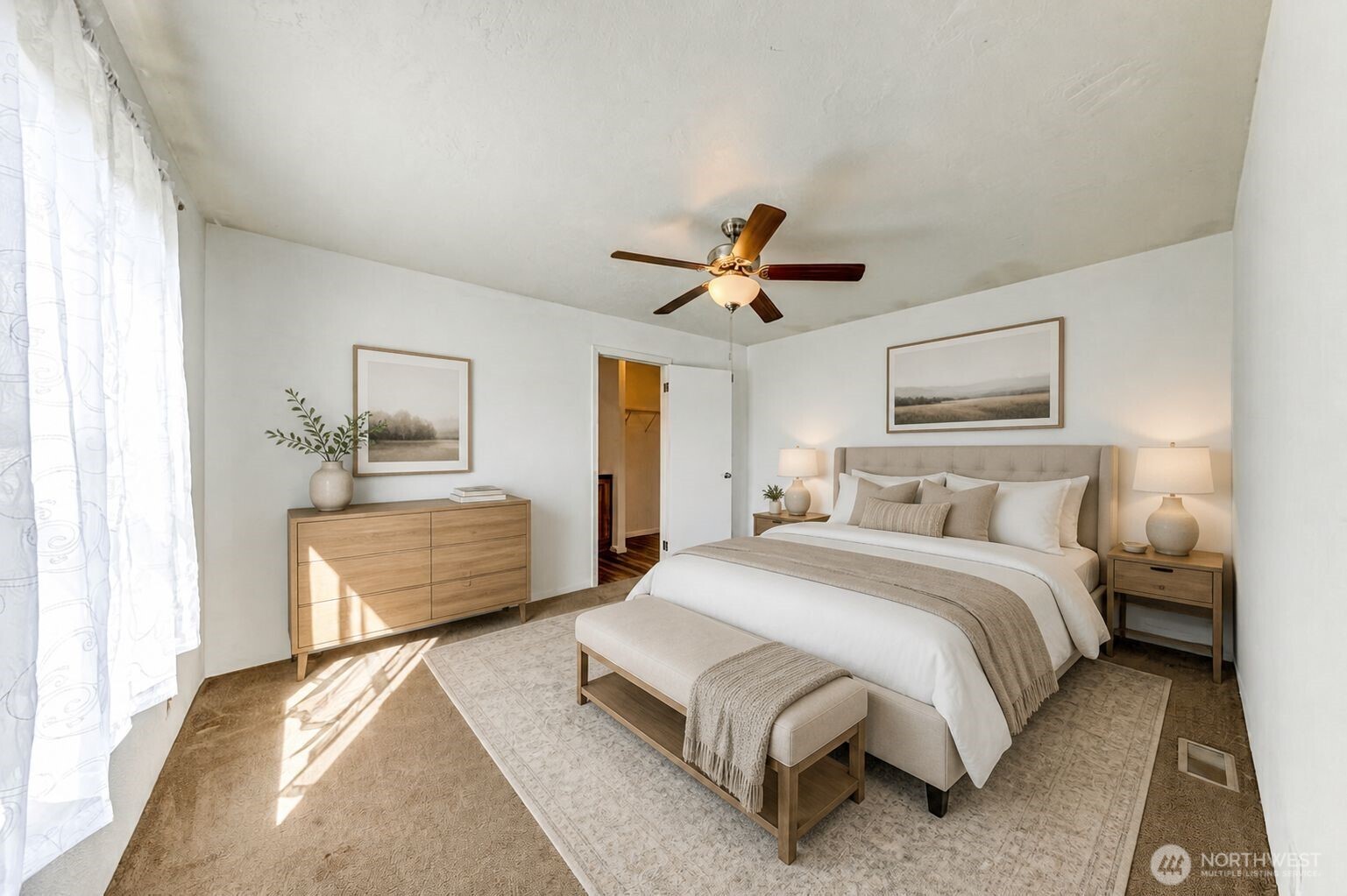 491 Mill Road, Unit 8 Sequim, WA 98382 - Photo 26 of 37 a bedroom with a bed and a chandelier