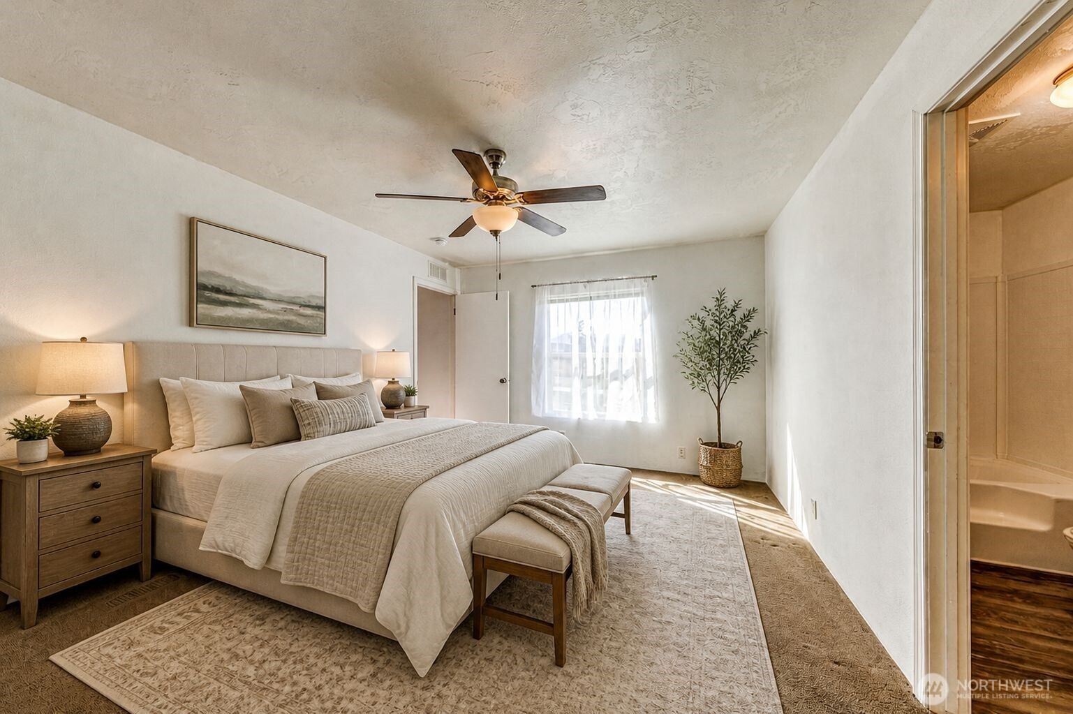 491 Mill Road, Unit 8 Sequim, WA 98382 - Photo 27 of 37 a bedroom with a bed couches and a flat tv screen