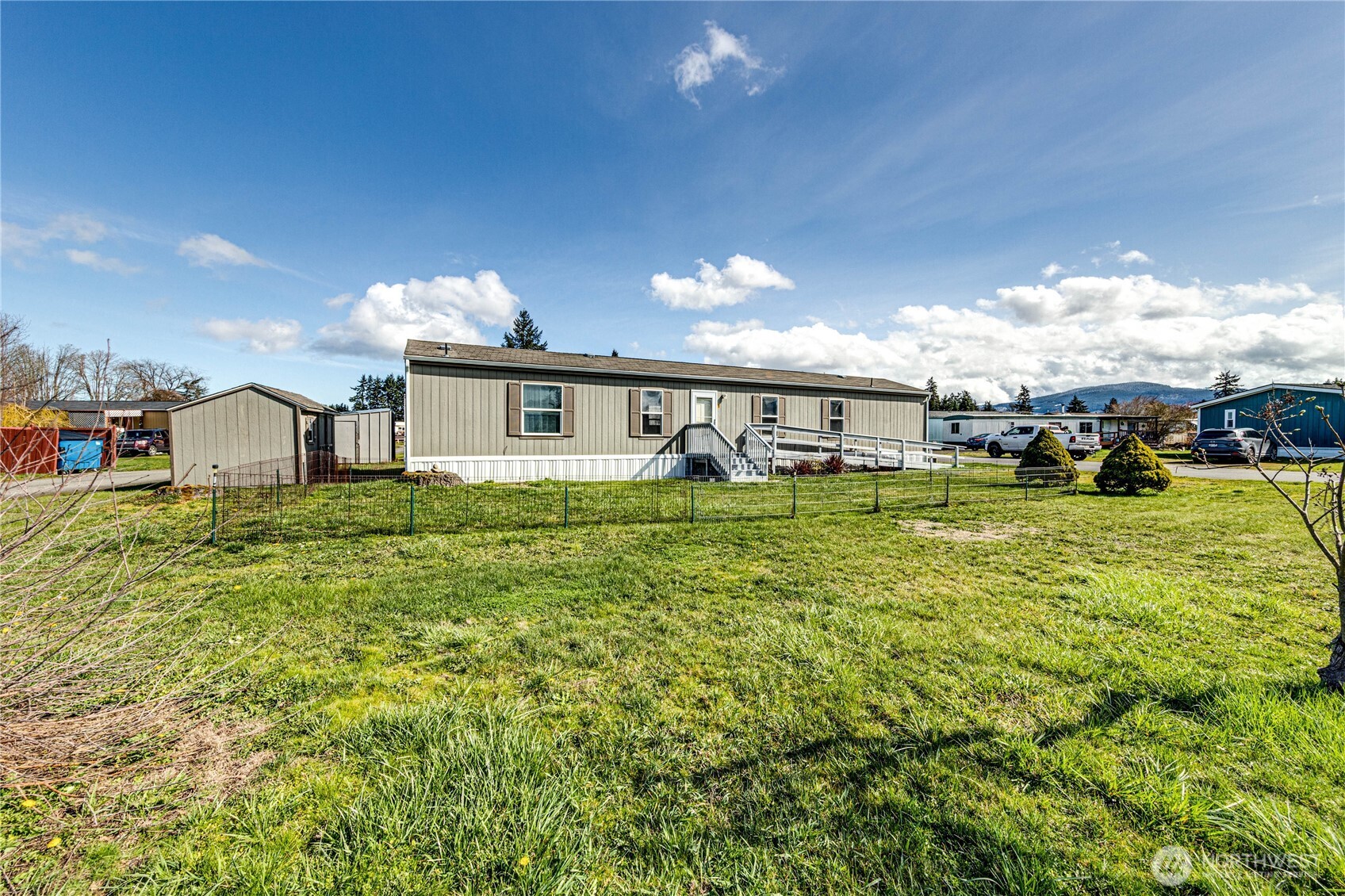 491 Mill Road, Unit 8 Sequim, WA 98382 - Photo 3 of 37 a view of a house with a yard