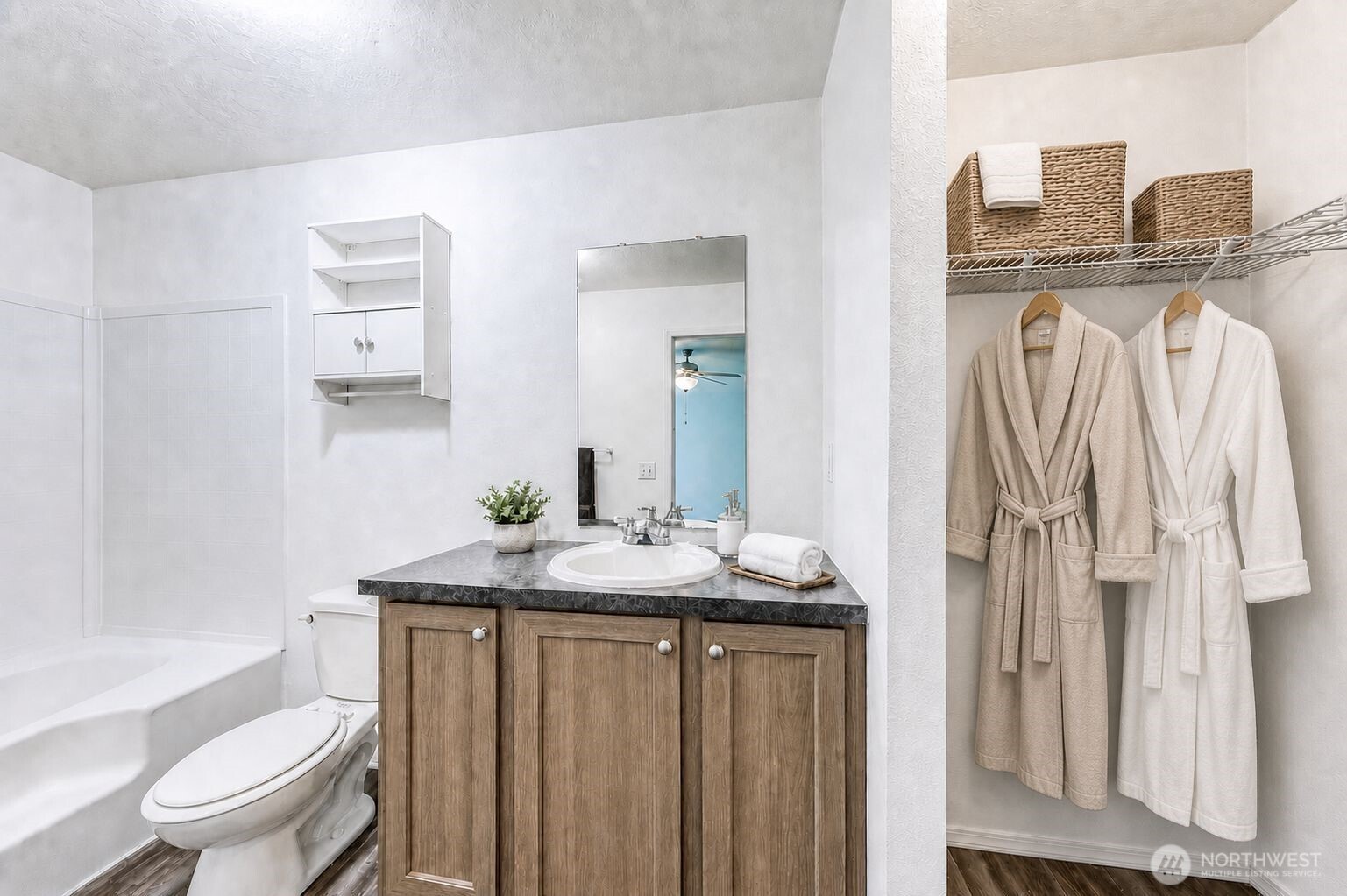 491 Mill Road, Unit 8 Sequim, WA 98382 - Photo 31 of 37 a bathroom with a granite countertop sink and a mirror