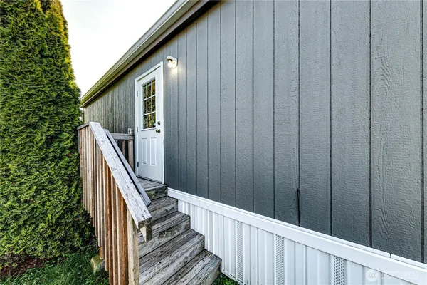 a view of a backyard with table and chairs