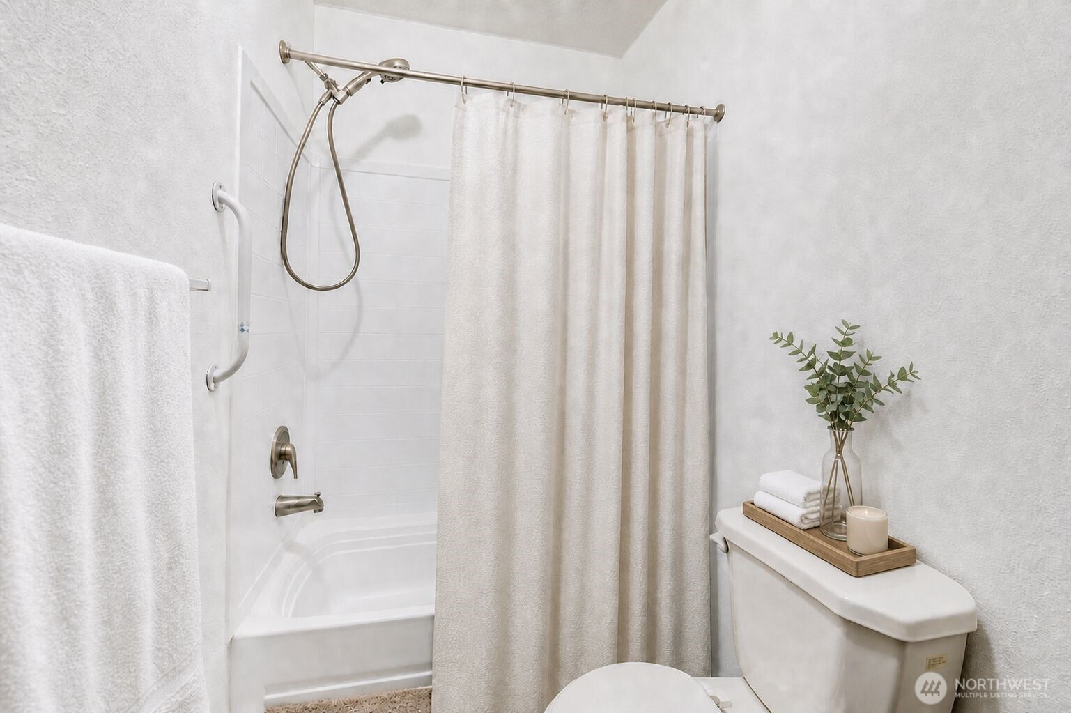 491 Mill Road, Unit 8 Sequim, WA 98382 - Photo 36 of 37 a bathroom with a shower curtain and a shower curtain
