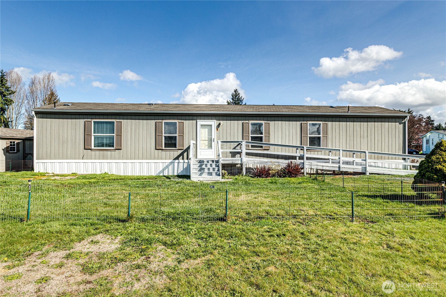 491 Mill Road, Unit 8 Sequim, WA 98382 - Photo 4 of 37 a front view of a house with garden