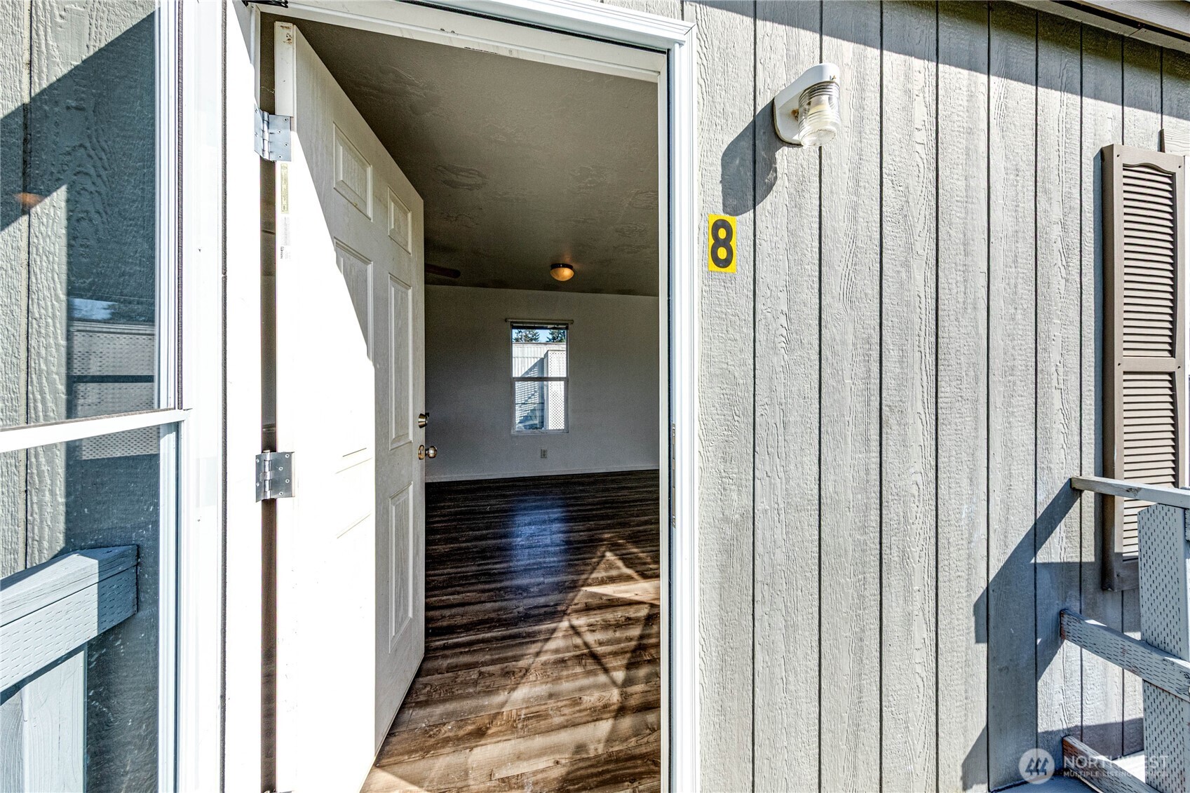 491 Mill Road, Unit 8 Sequim, WA 98382 - Photo 8 of 37 a view of a back door of the house