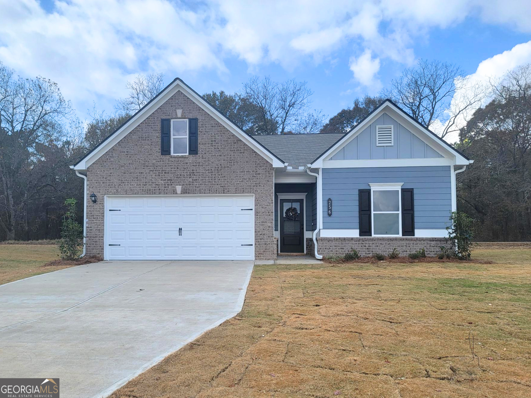 256 Shantz Way, Unit (LOT A45) Byron, GA 31008 - Photo 1 of 25 a front view of a house with a yard and garage