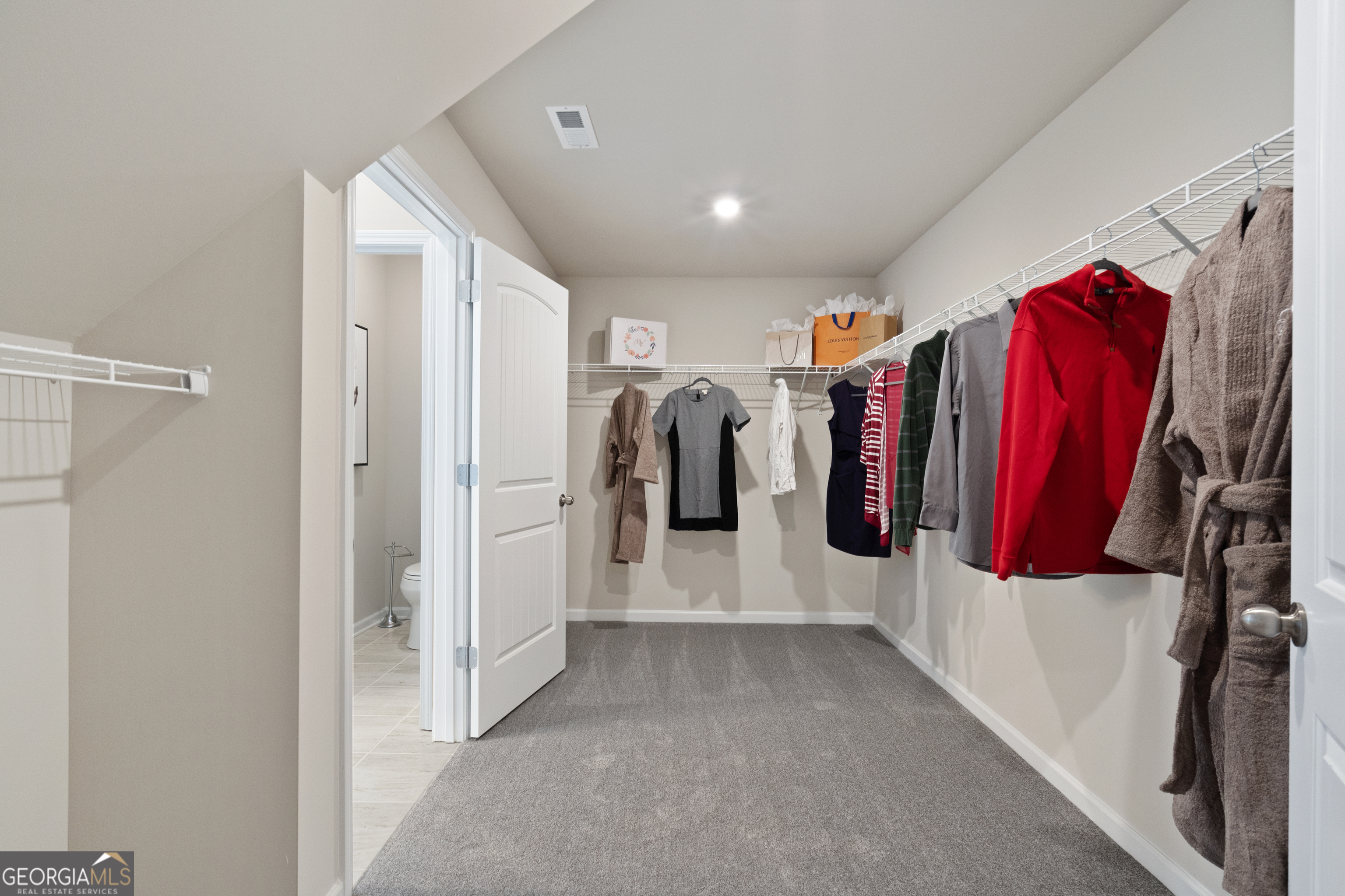 256 Shantz Way, Unit (LOT A45) Byron, GA 31008 - Photo 21 of 25 a view of walk in closet with clothes