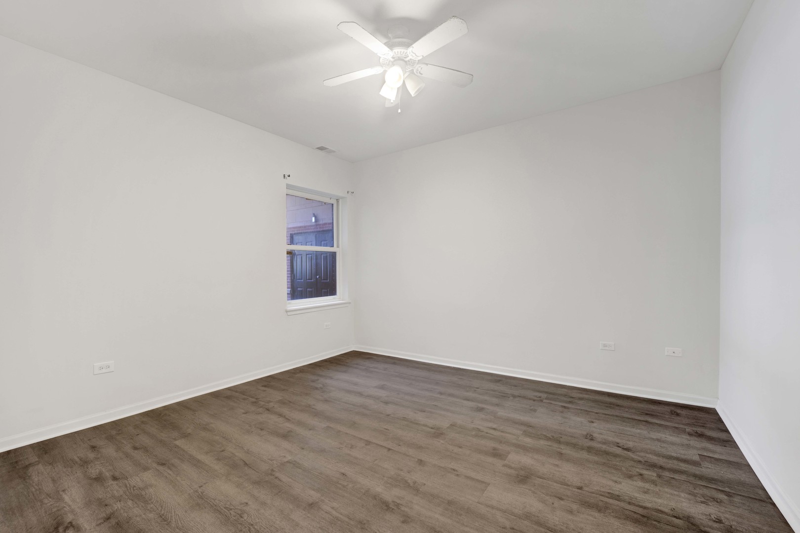 948 West 15th Place, Unit 1B Chicago, IL 60608 - Photo 12 of 59 wooden floor in an empty room
