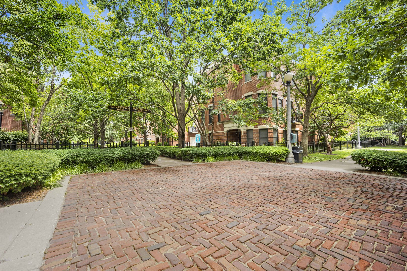 948 West 15th Place, Unit 1B Chicago, IL 60608 - Photo 26 of 59 a front view of a house with a garden and trees