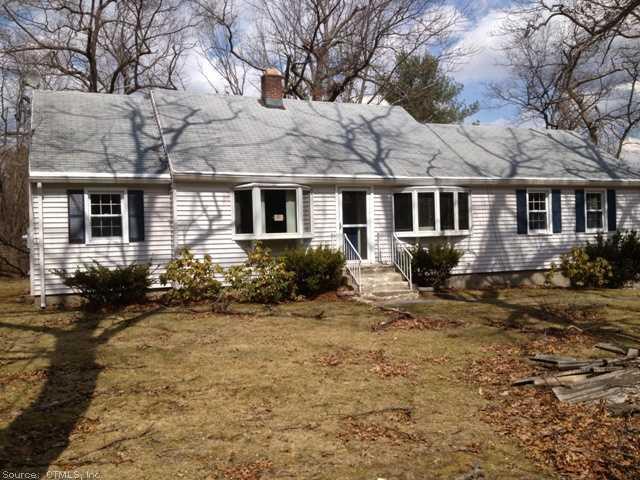 a front view of a house with yard