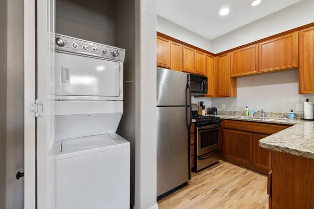 a kitchen with a refrigerator sink and stove