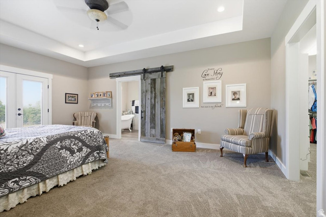 3123 East Riverdale Road Preston, ID 83263 - Photo 21 of 52 Carpeted bedroom featuring a tray ceiling with recessed lighting and a ceiling fan