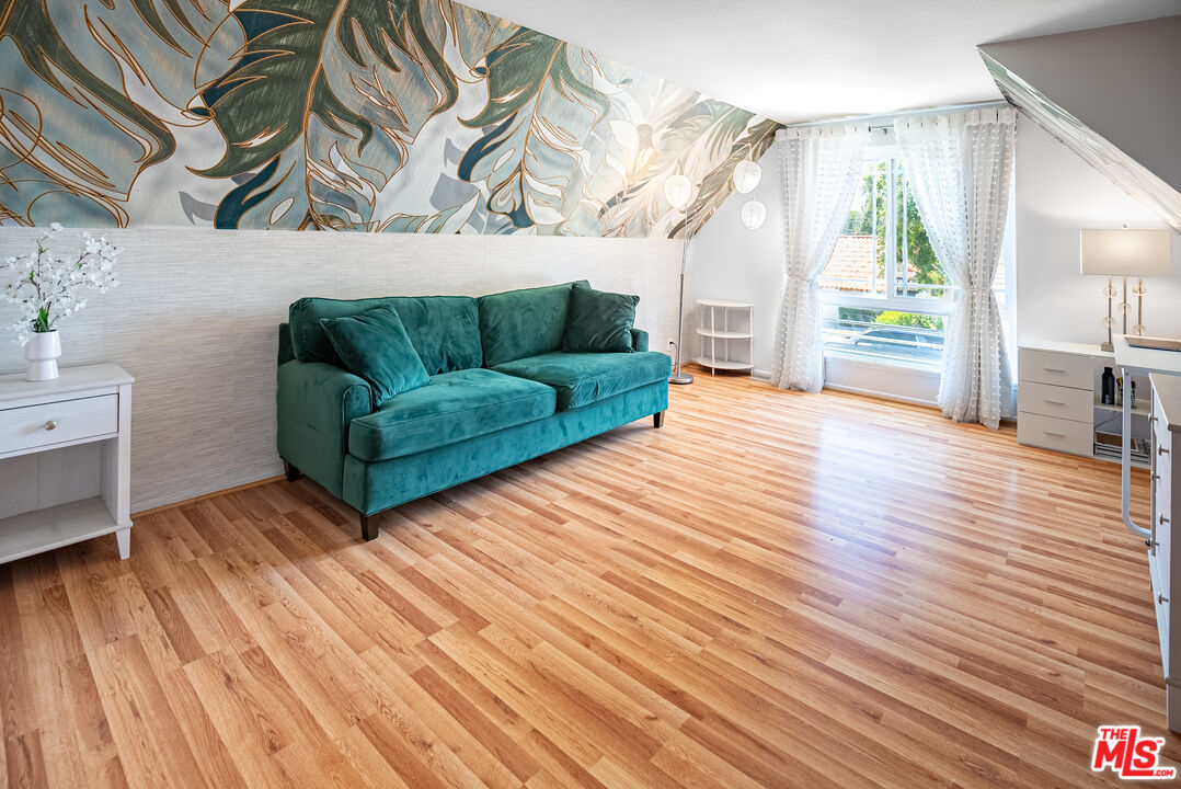 27003 Rio Prado Drive Valencia, CA 91354 - Photo 17 of 40 a living room with furniture and a wooden floor