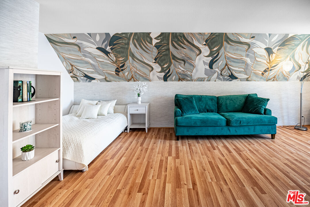 27003 Rio Prado Drive Valencia, CA 91354 - Photo 19 of 40 a bedroom with a bed and a wooden floor