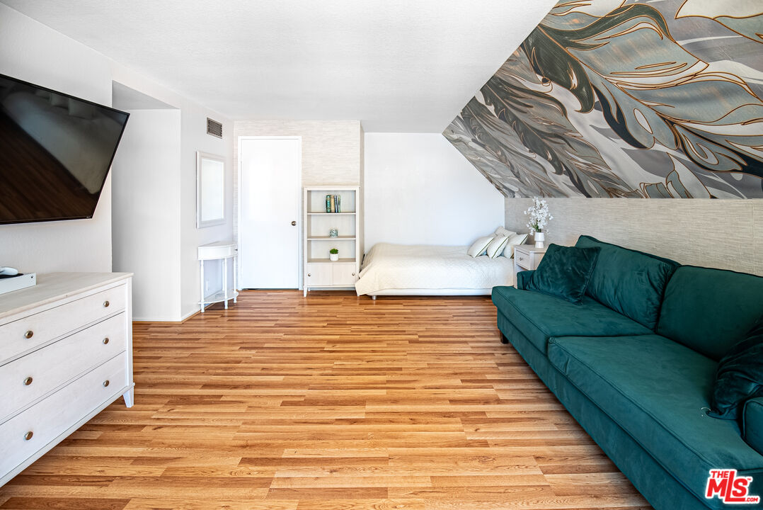 27003 Rio Prado Drive Valencia, CA 91354 - Photo 20 of 40 a living room with furniture and a flat screen tv