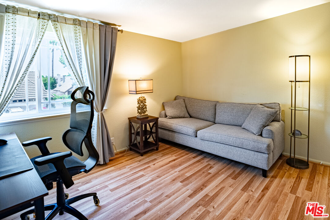 27003 Rio Prado Drive Valencia, CA 91354 - Photo 22 of 40 a living room with a couch and a table
