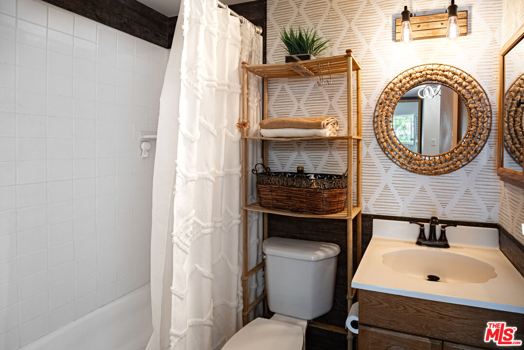 27003 Rio Prado Drive Valencia, CA 91354 - Photo 24 of 40 a bathroom with a sink and a toilet