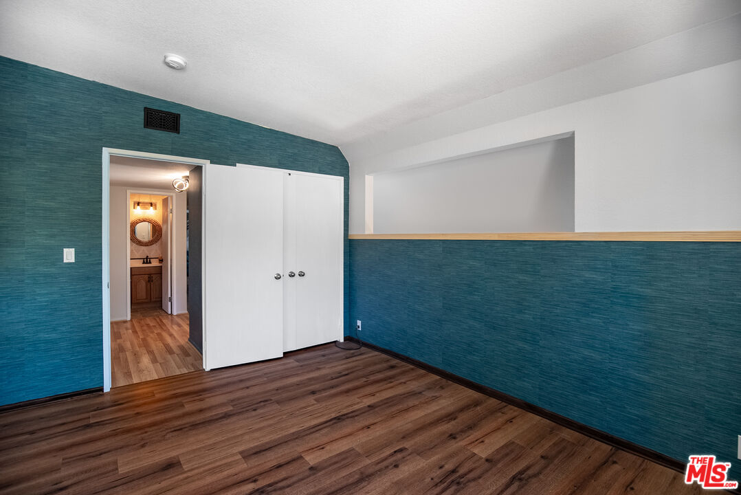 27003 Rio Prado Drive Valencia, CA 91354 - Photo 27 of 40 a view of hallway with wooden floor