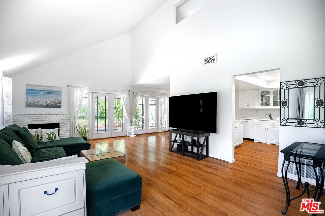 27003 Rio Prado Drive Valencia, CA 91354 - Photo 3 of 40 a living room with furniture and a flat screen tv