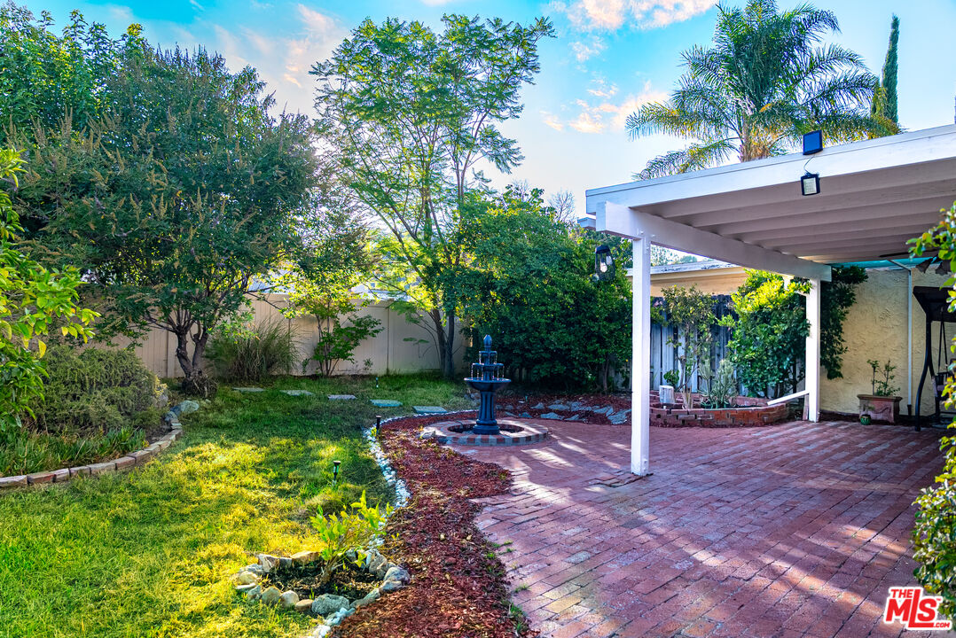 27003 Rio Prado Drive Valencia, CA 91354 - Photo 32 of 40 a view of a backyard with a garden