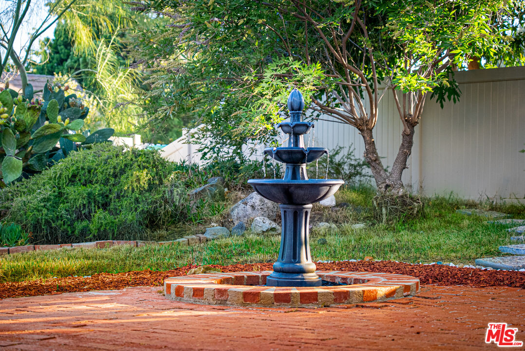 27003 Rio Prado Drive Valencia, CA 91354 - Photo 36 of 40 a front view of a house with a yard and trees