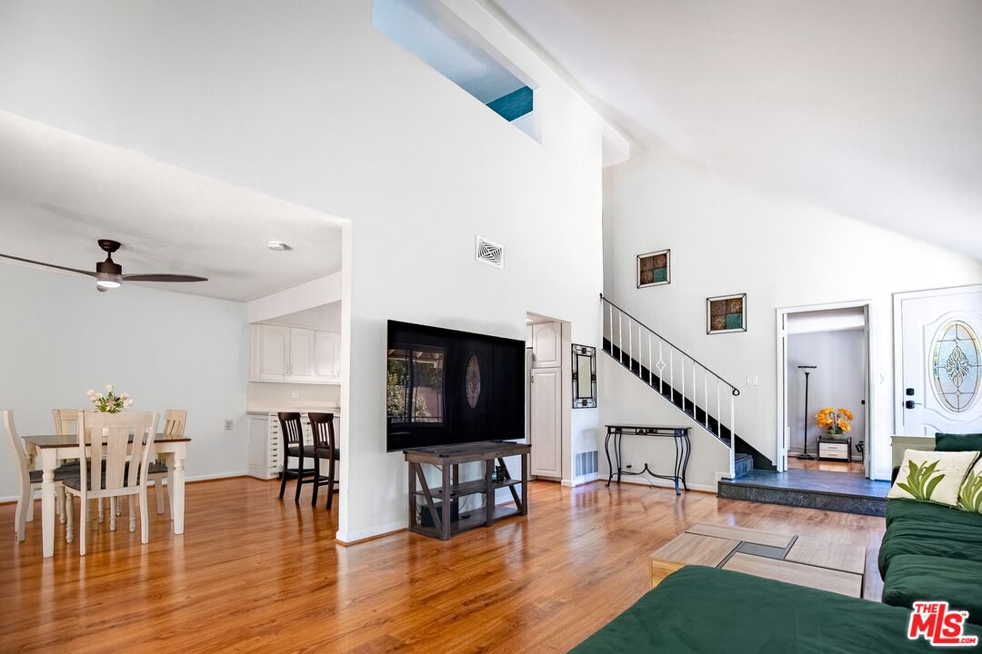 27003 Rio Prado Drive Valencia, CA 91354 - Photo 4 of 40 a living room with furniture and a flat screen tv