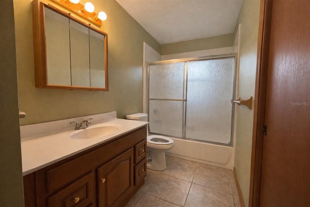 5028 Ralston Road Lakeland, FL 33811 - Photo 13 of 29 a bathroom with a sink and a toilet
