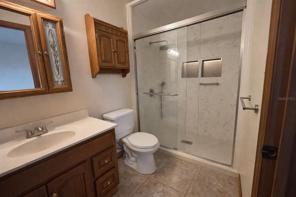 5028 Ralston Road Lakeland, FL 33811 - Photo 14 of 29 a bathroom with a sink and a mirror