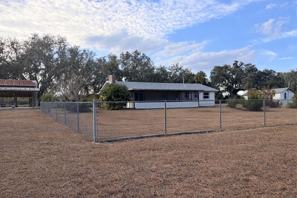 5028 Ralston Road Lakeland, FL 33811 - Photo 17 of 29 a view of backyard with wooden fence