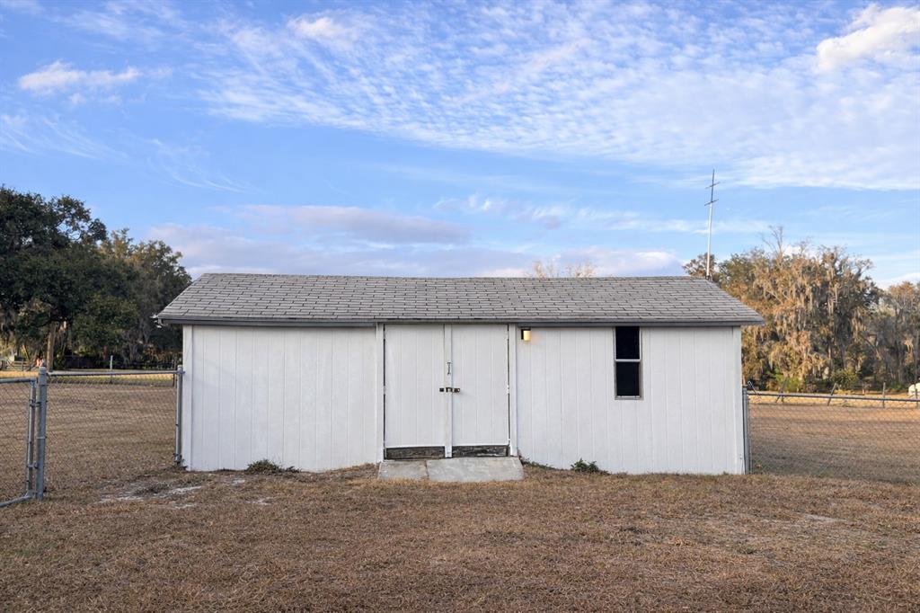 5028 Ralston Road Lakeland, FL 33811 - Photo 19 of 29 a view of a house with backyard and trees