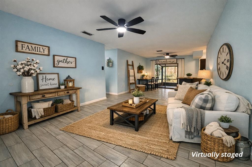 5028 Ralston Road Lakeland, FL 33811 - Photo 21 of 29 a living room with furniture and a chandelier