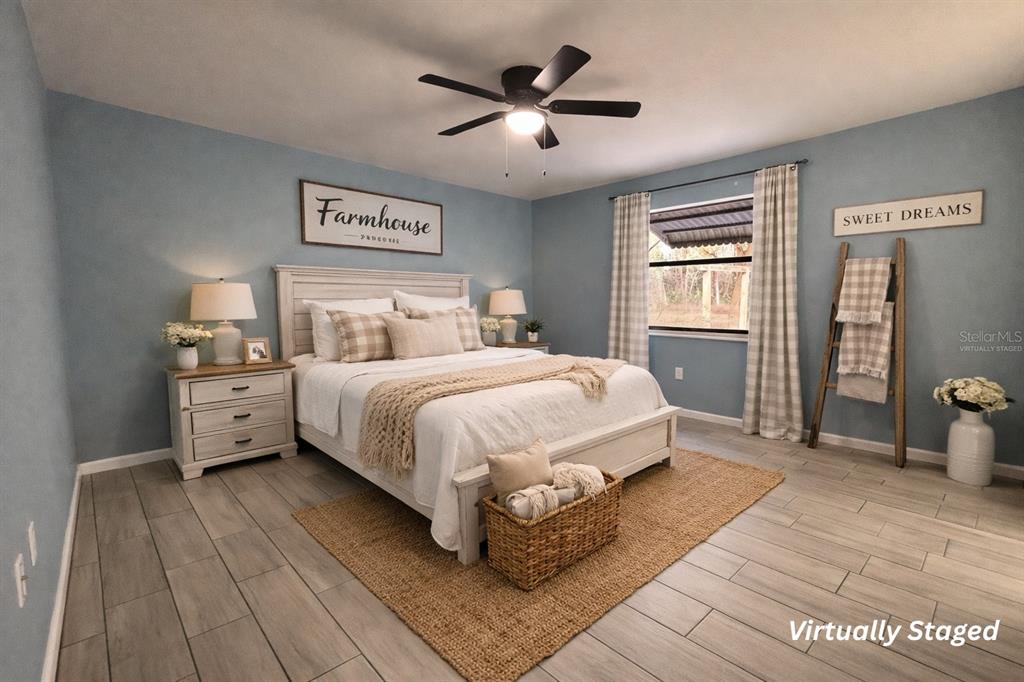 5028 Ralston Road Lakeland, FL 33811 - Photo 23 of 29 a bedroom with a large bed and a window