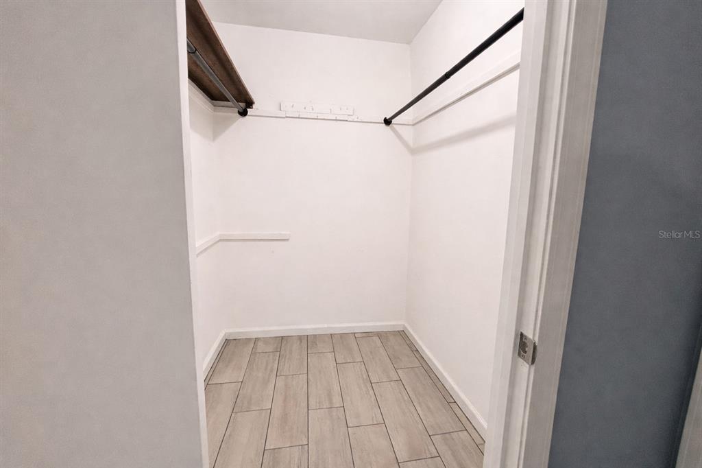 5028 Ralston Road Lakeland, FL 33811 - Photo 24 of 29 a view of a room with wooden floor and white walls