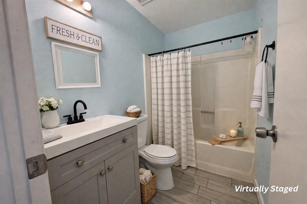 5028 Ralston Road Lakeland, FL 33811 - Photo 25 of 29 a bathroom with a sink a toilet and shower