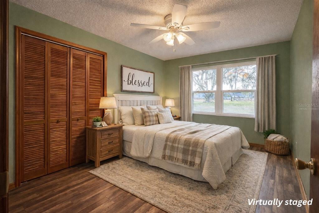 5028 Ralston Road Lakeland, FL 33811 - Photo 9 of 29 a bedroom with a bed and a large window