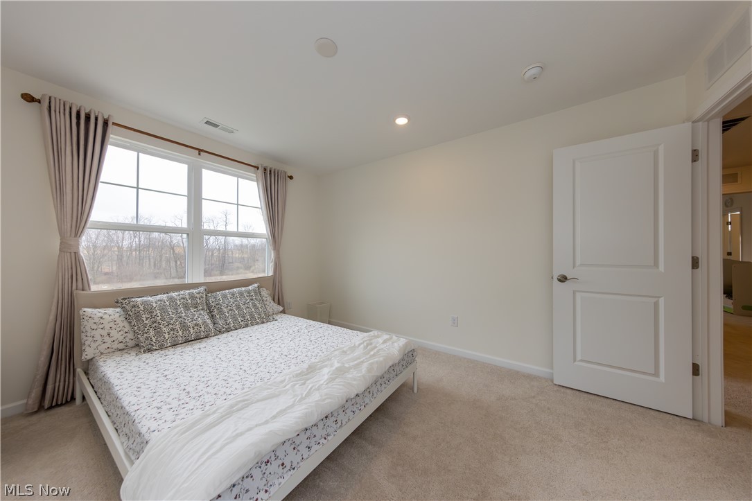 766 River Run Road Aurora, OH 44202 - Photo 31 of 49 Bedroom with light carpet and recessed lighting