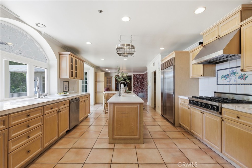 960 Hampton Road Arcadia, CA 91006 - Photo 11 of 28 a large kitchen with stainless steel appliances granite countertop a stove and a sink