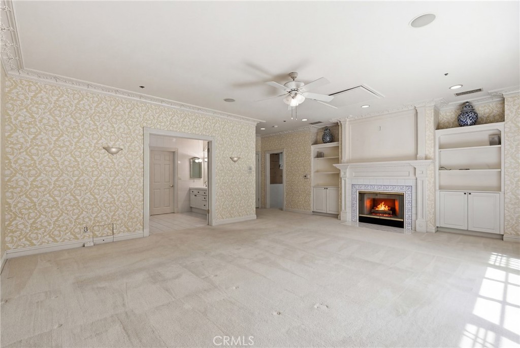 960 Hampton Road Arcadia, CA 91006 - Photo 13 of 28 an empty room with furniture and a fireplace