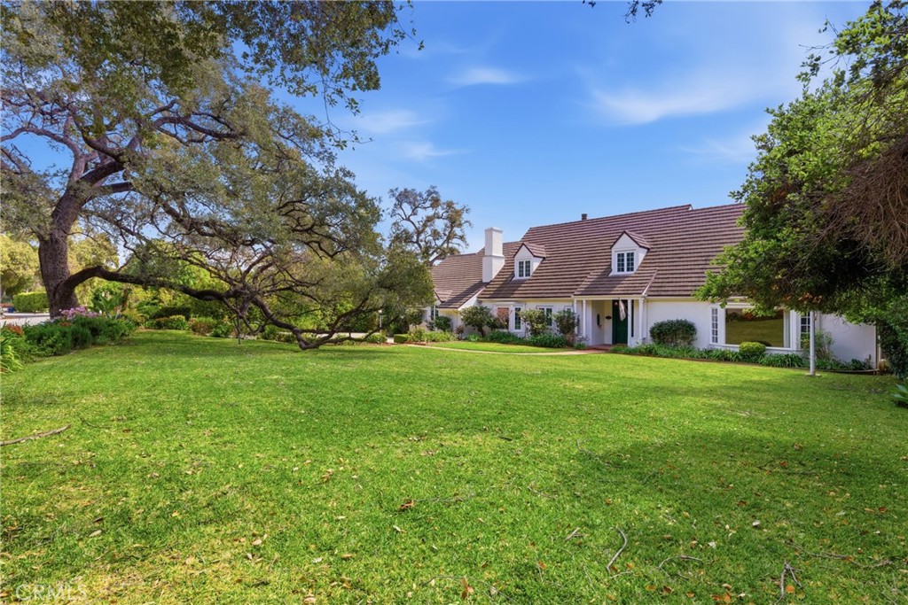 960 Hampton Road Arcadia, CA 91006 - Photo 4 of 28 a view of a big house with a big yard and large trees