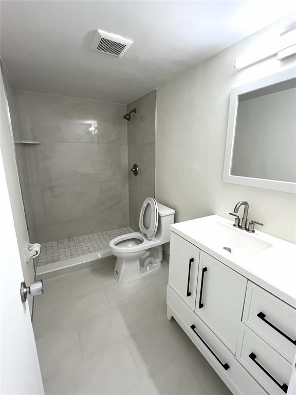 505 Northeast 20th Avenue, Unit 118 Deerfield Beach, FL 33441 - Photo 6 of 22 a view of bathroom with a sink and mirror