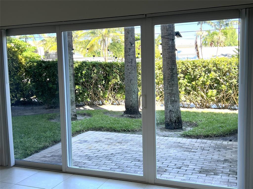 505 Northeast 20th Avenue, Unit 118 Deerfield Beach, FL 33441 - Photo 10 of 22 a view of a porch with a yard