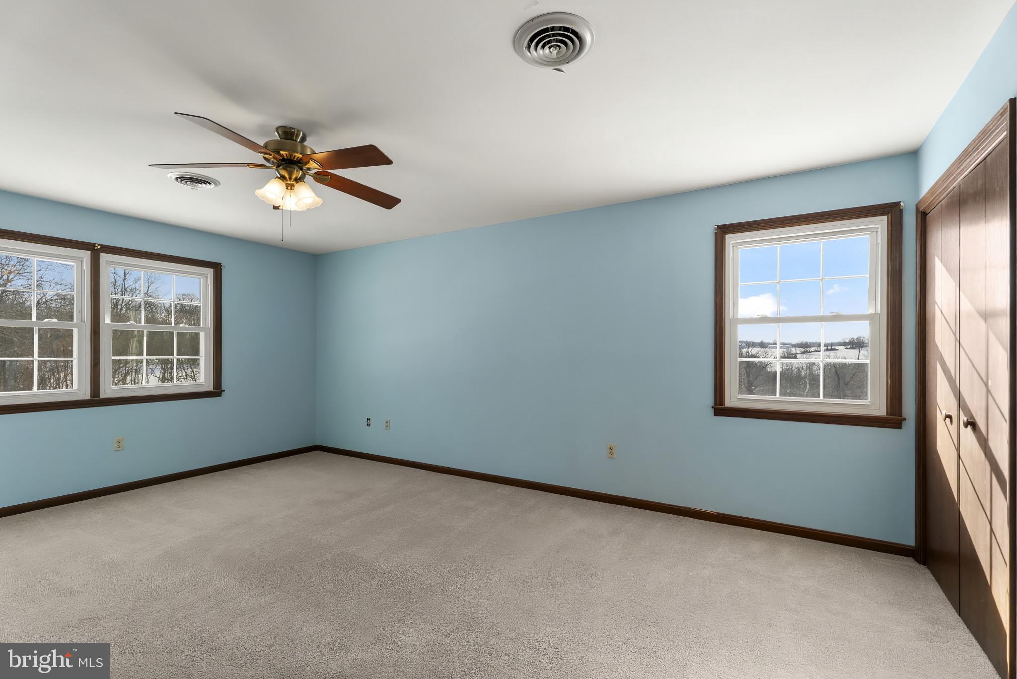 7823 Timmons Road Mount Airy, MD 21771 - Photo 20 of 38 an empty room with a window and a fan