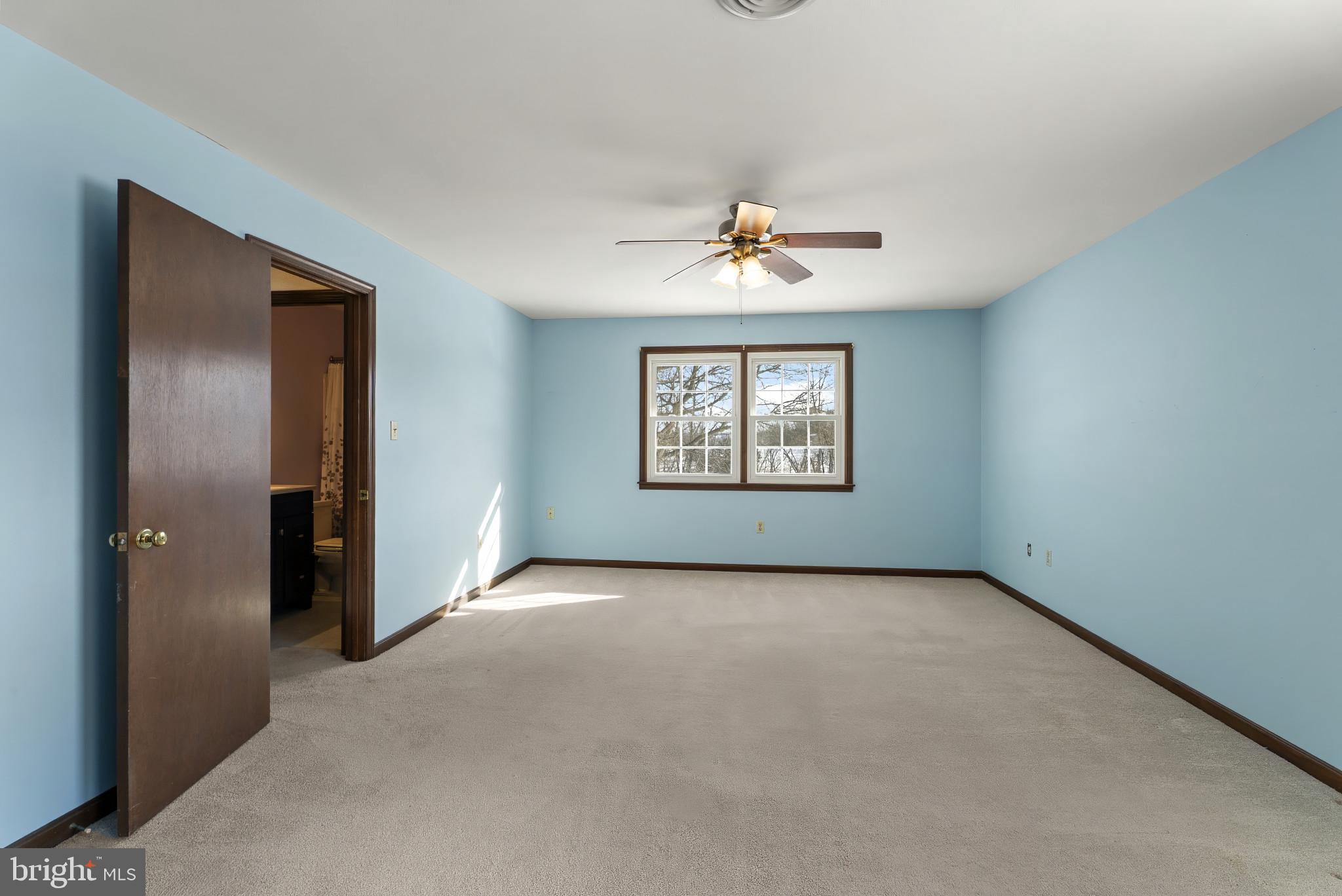 7823 Timmons Road Mount Airy, MD 21771 - Photo 21 of 38 an empty room with windows and mirror