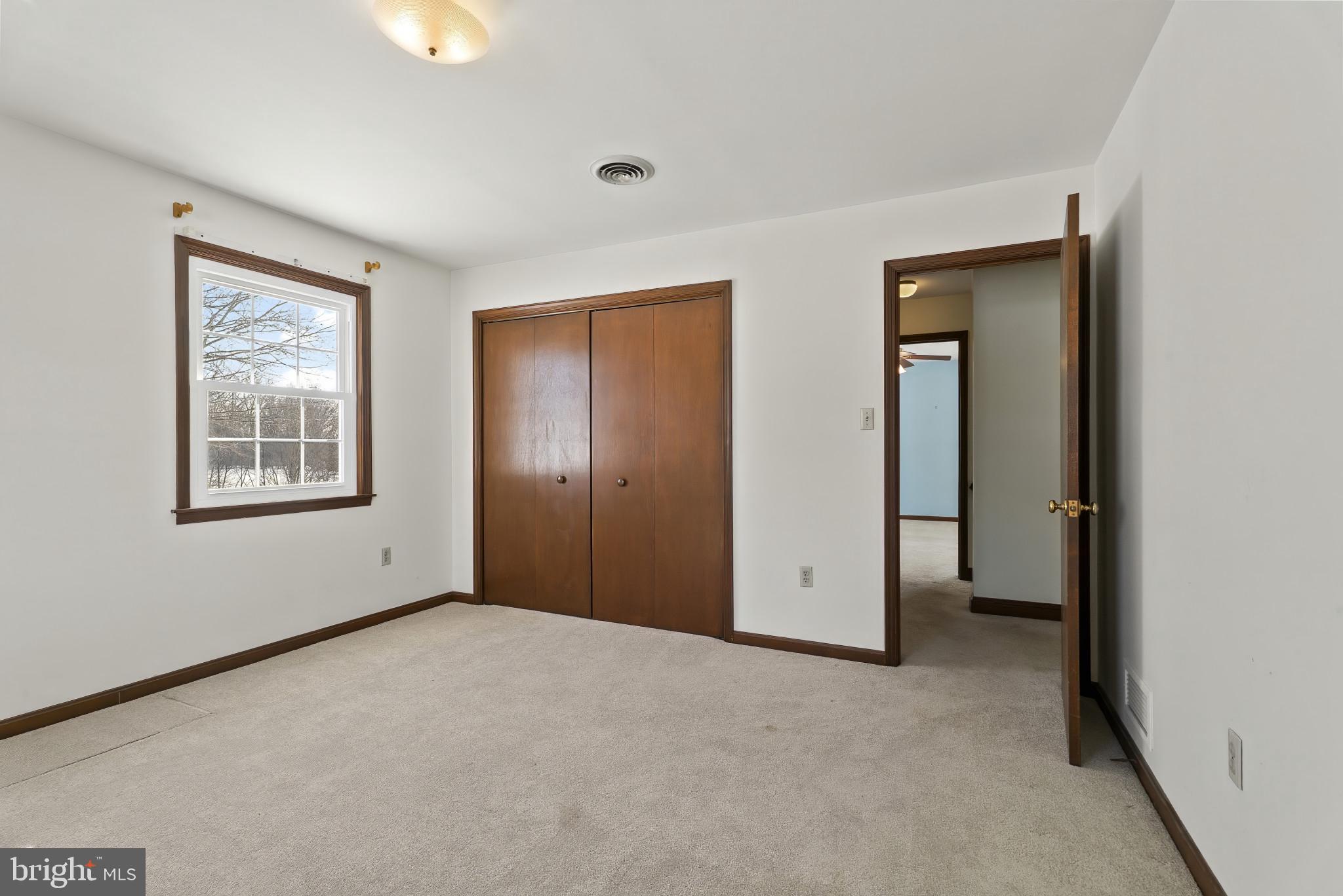 7823 Timmons Road Mount Airy, MD 21771 - Photo 26 of 38 a view of an empty room with window and closet