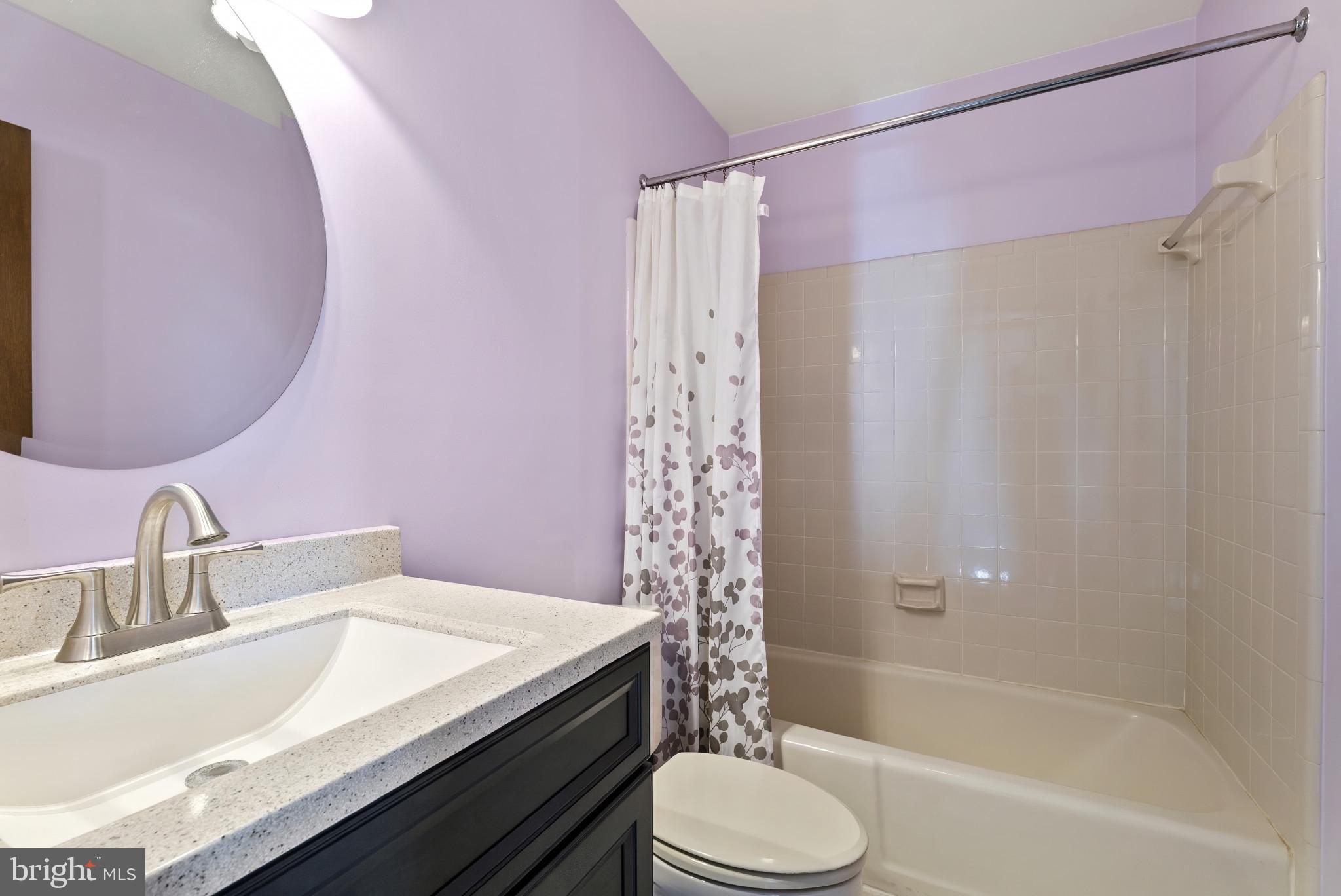 7823 Timmons Road Mount Airy, MD 21771 - Photo 29 of 38 a bathroom with a granite countertop sink toilet and shower