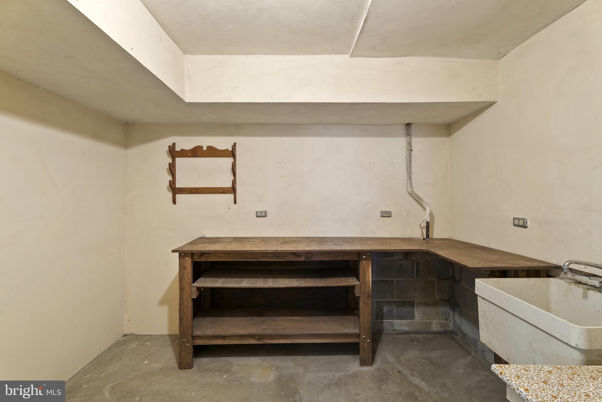 7823 Timmons Road Mount Airy, MD 21771 - Photo 31 of 38 a room with a sink and a mirror