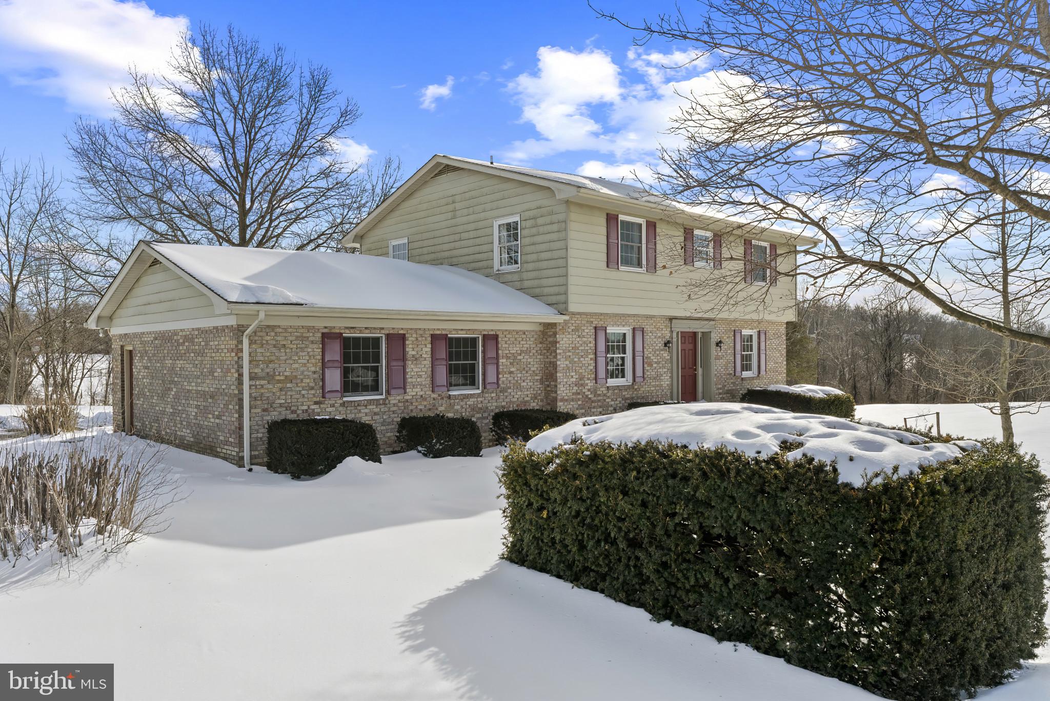 7823 Timmons Road Mount Airy, MD 21771 - Photo 4 of 38 a front view of a house with yard covered in snow